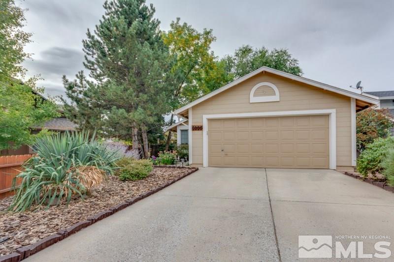 6006 White Water Way Reno, NV 89523 - Photo 5 of 20 a front view of a house with a yard and garage