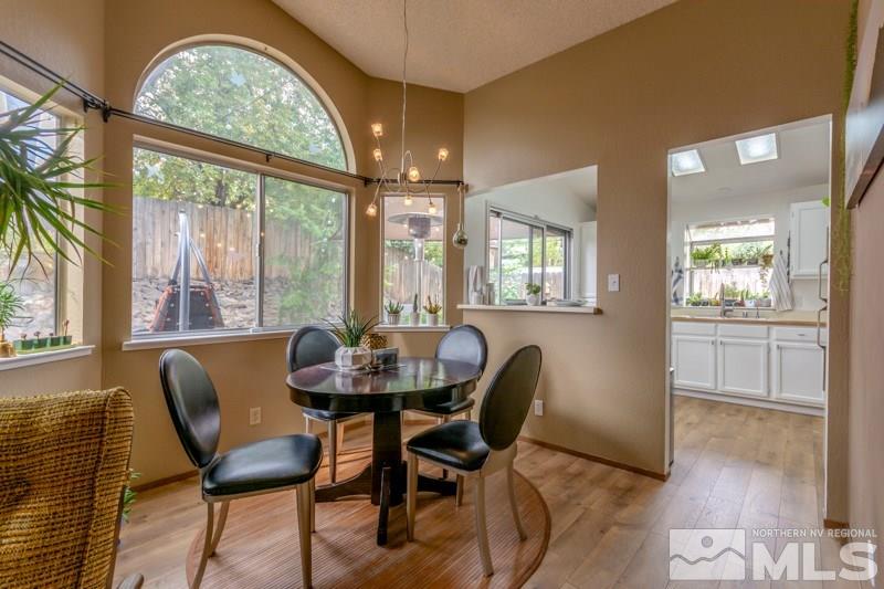 6006 White Water Way Reno, NV 89523 - Photo 6 of 20 a view of a dining room with furniture and windows