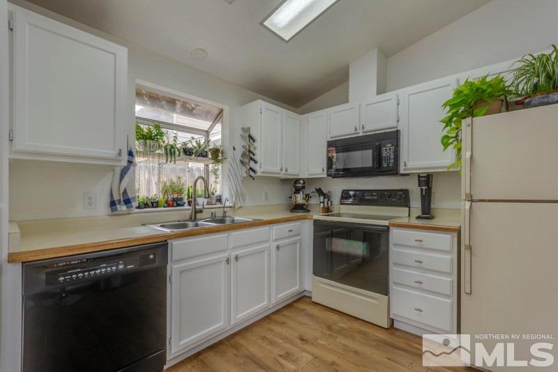 6006 White Water Way Reno, NV 89523 - Photo 8 of 20 a kitchen with a sink stove and refrigerator