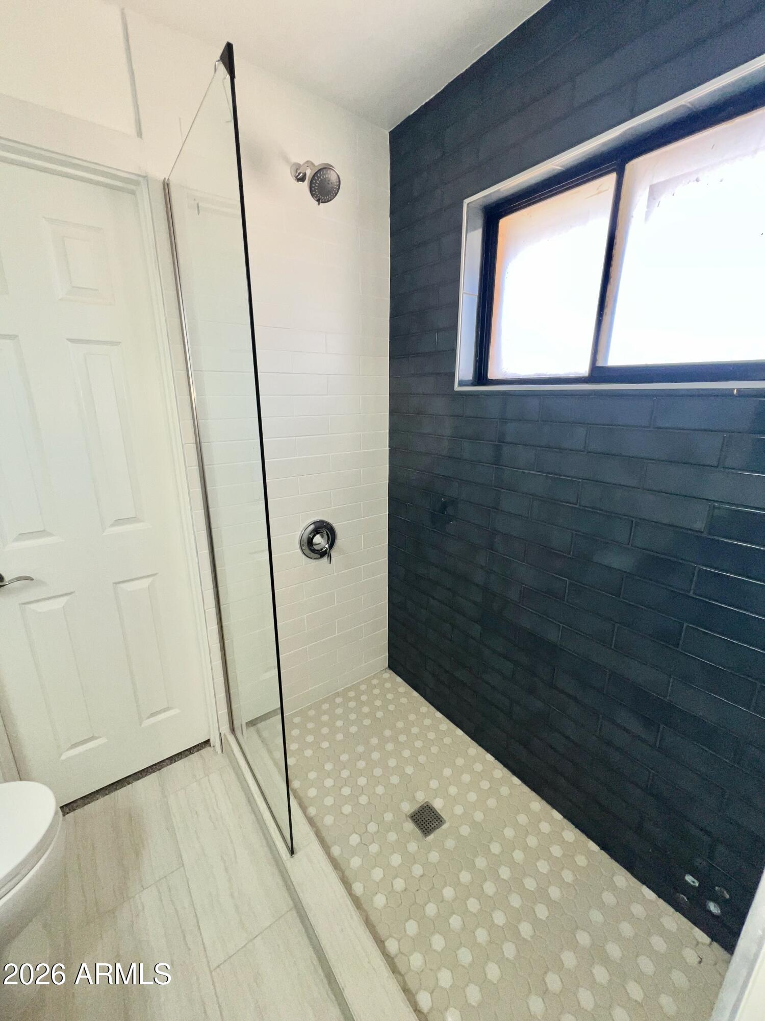 3818 West Ruth Avenue Phoenix, AZ 85051 - Photo 16 of 20 a bathroom with a shower