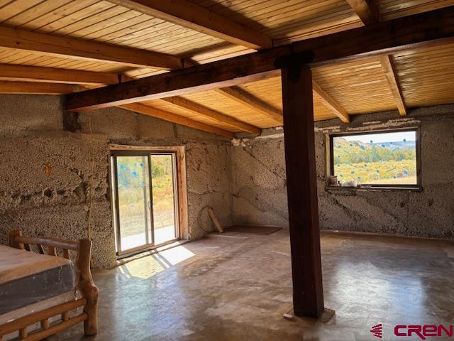 406 Canyon Road Antonito, CO 81120 - Photo 8 of 16 a view of a room with wooden floor and iron stairs
