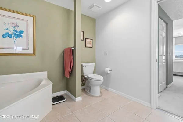 a bathroom with a sink toilet and a mirror