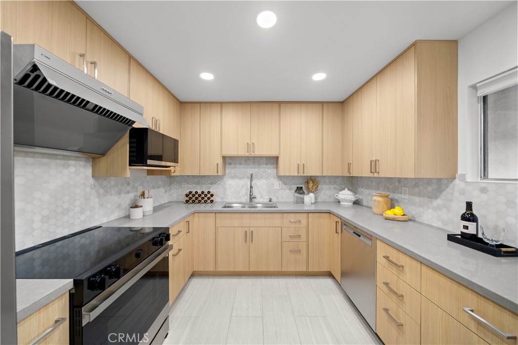 540 Fairview Avenue, Unit 27 Arcadia, CA 91007 - Photo 14 of 58 a kitchen with a sink stove top oven and cabinets