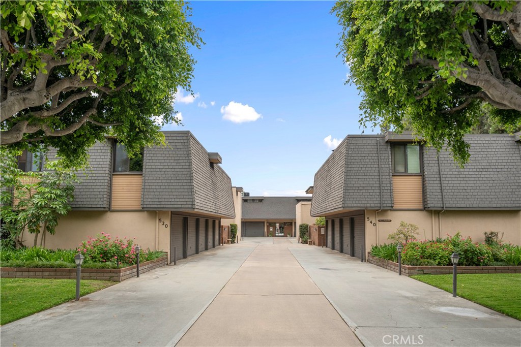 540 Fairview Avenue, Unit 27 Arcadia, CA 91007 - Photo 3 of 58 a front view of a house with a yard and potted plants