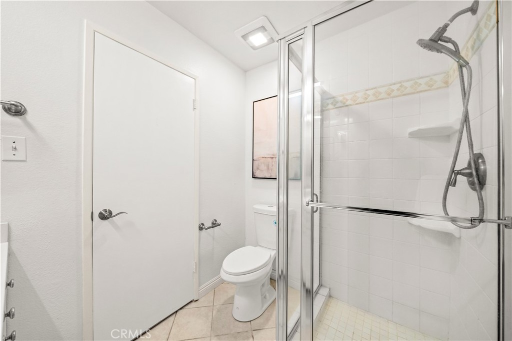 540 Fairview Avenue, Unit 27 Arcadia, CA 91007 - Photo 37 of 58 a bathroom with a granite countertop shower a toilet and a shower