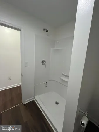 a bathroom with a tub and shower