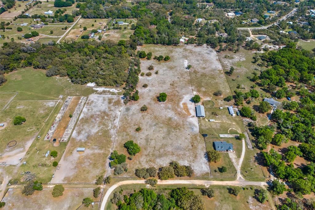 Winterwillow Lane Eustis, FL 32736 - Photo 15 of 28 an aerial view of waterside residential houses with outdoor space