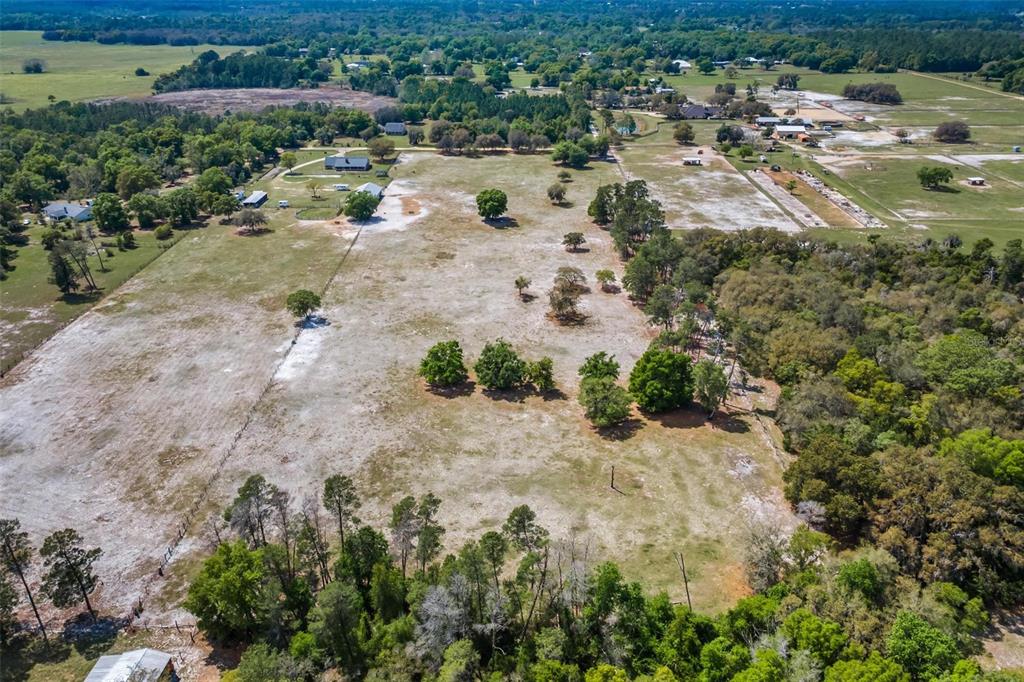Winterwillow Lane Eustis, FL 32736 - Photo 21 of 28 a view of a lake with lots of trees and houses