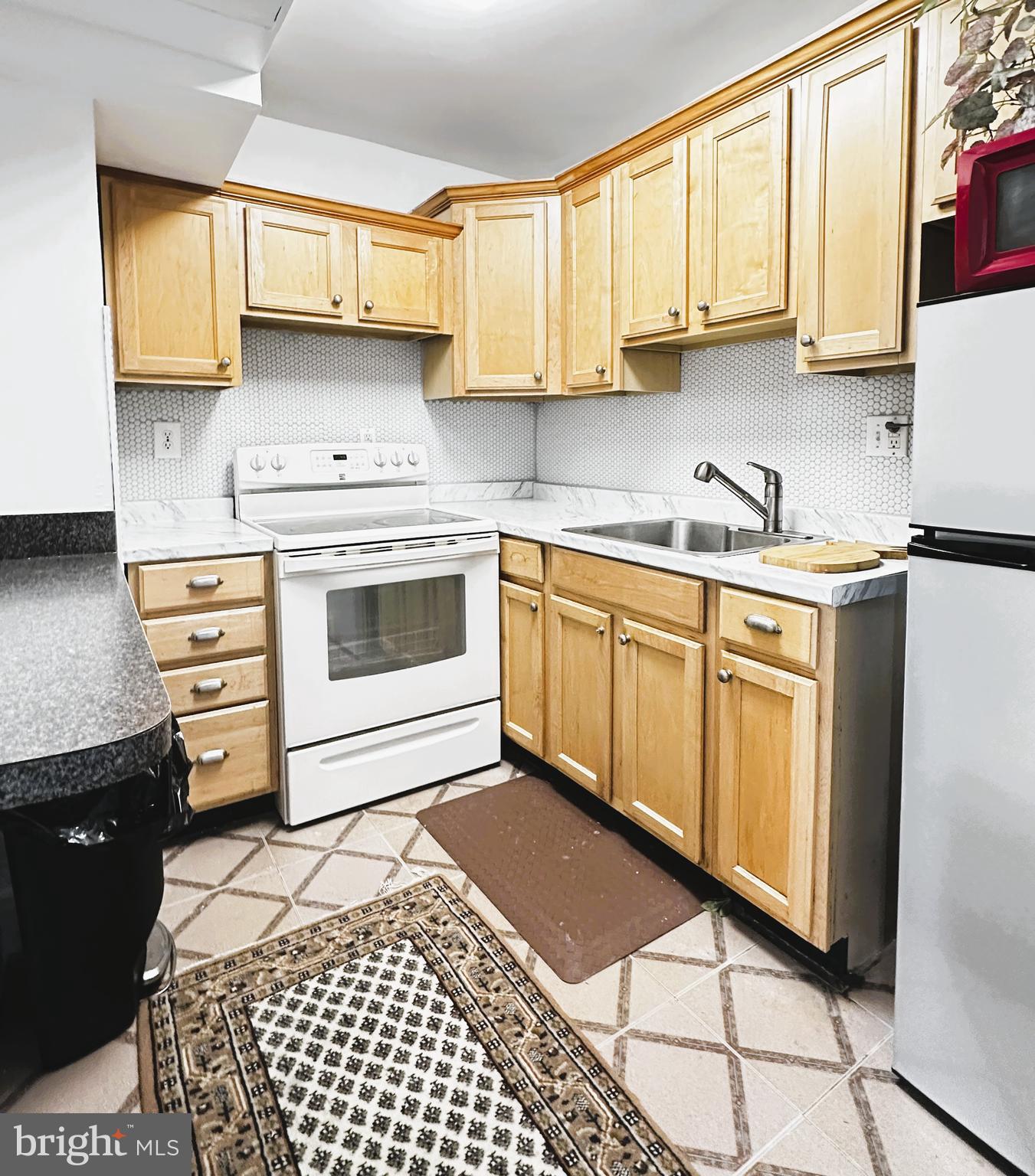 101 South Raleigh Avenue Atlantic City, NJ 08401 - Photo 2 of 18 a kitchen with stainless steel appliances a stove a sink and a cabinets