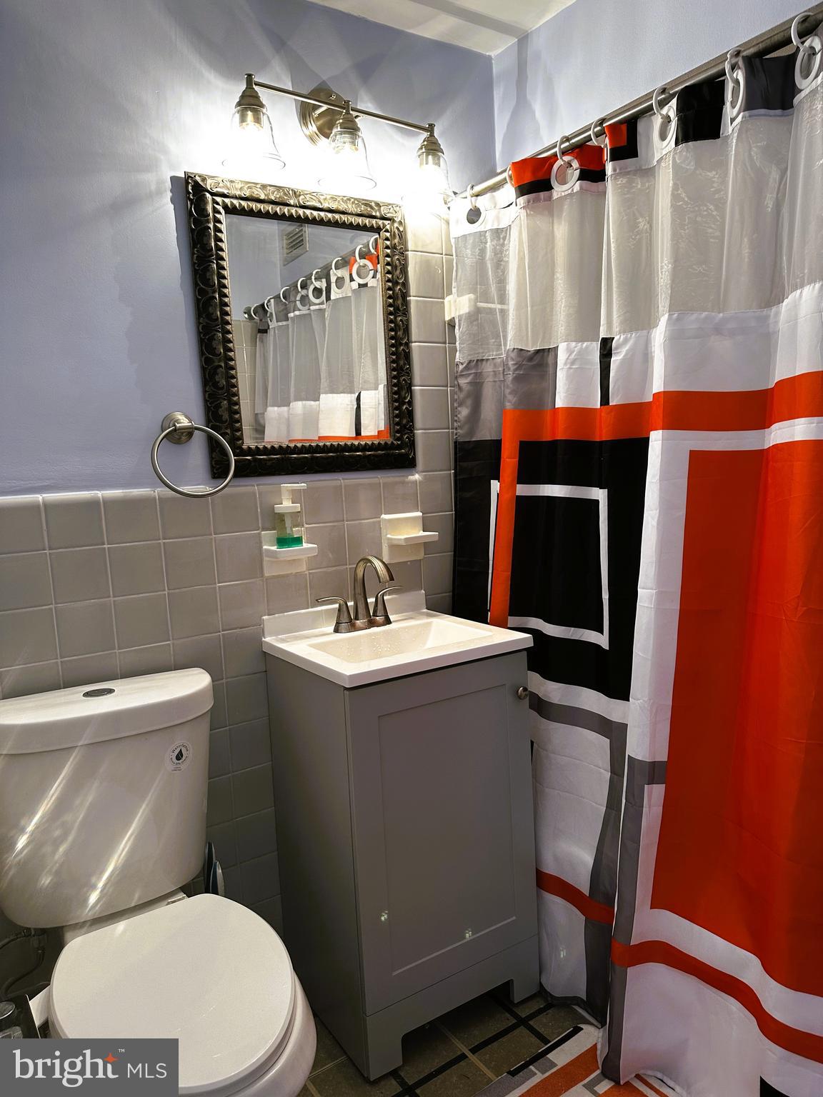 101 South Raleigh Avenue Atlantic City, NJ 08401 - Photo 10 of 18 a bathroom with a sink a toilet and shower