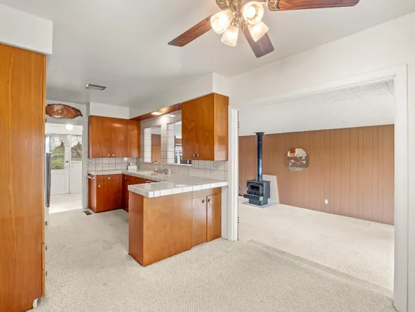 a kitchen with stainless steel appliances a refrigerator and a sink