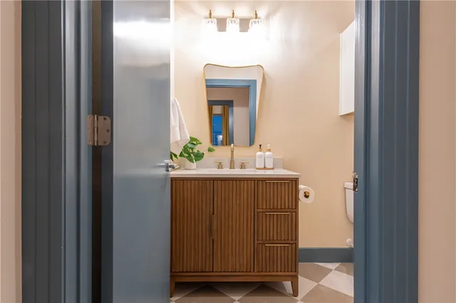 a bathroom with a sink and a mirror