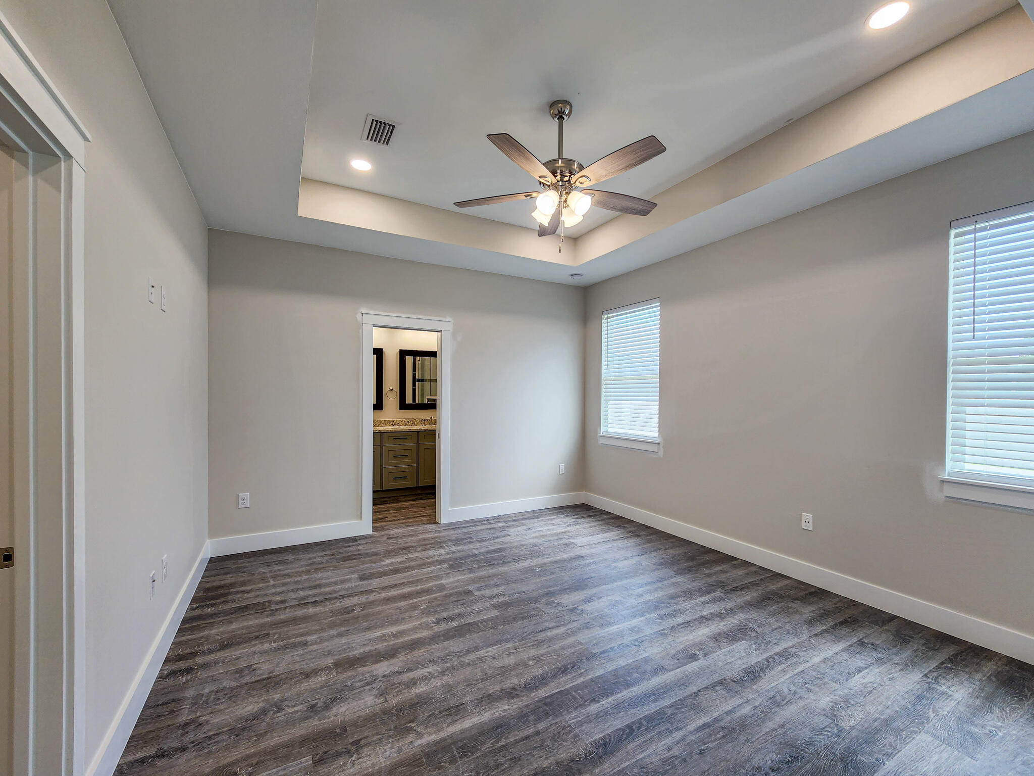 2199 Paloma Street Navarre, FL 32566 - Photo 11 of 27 a view of an empty room with a window and wooden floor