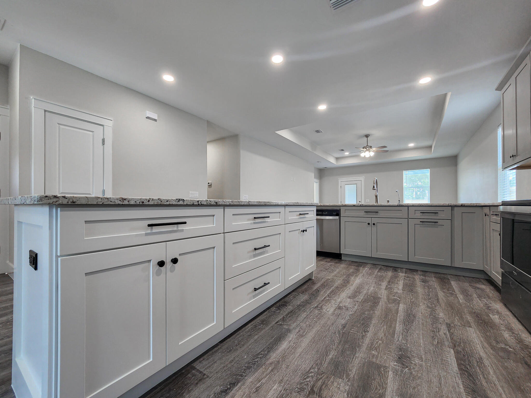 2199 Paloma Street Navarre, FL 32566 - Photo 6 of 27 a large kitchen with cabinets and stainless steel appliances