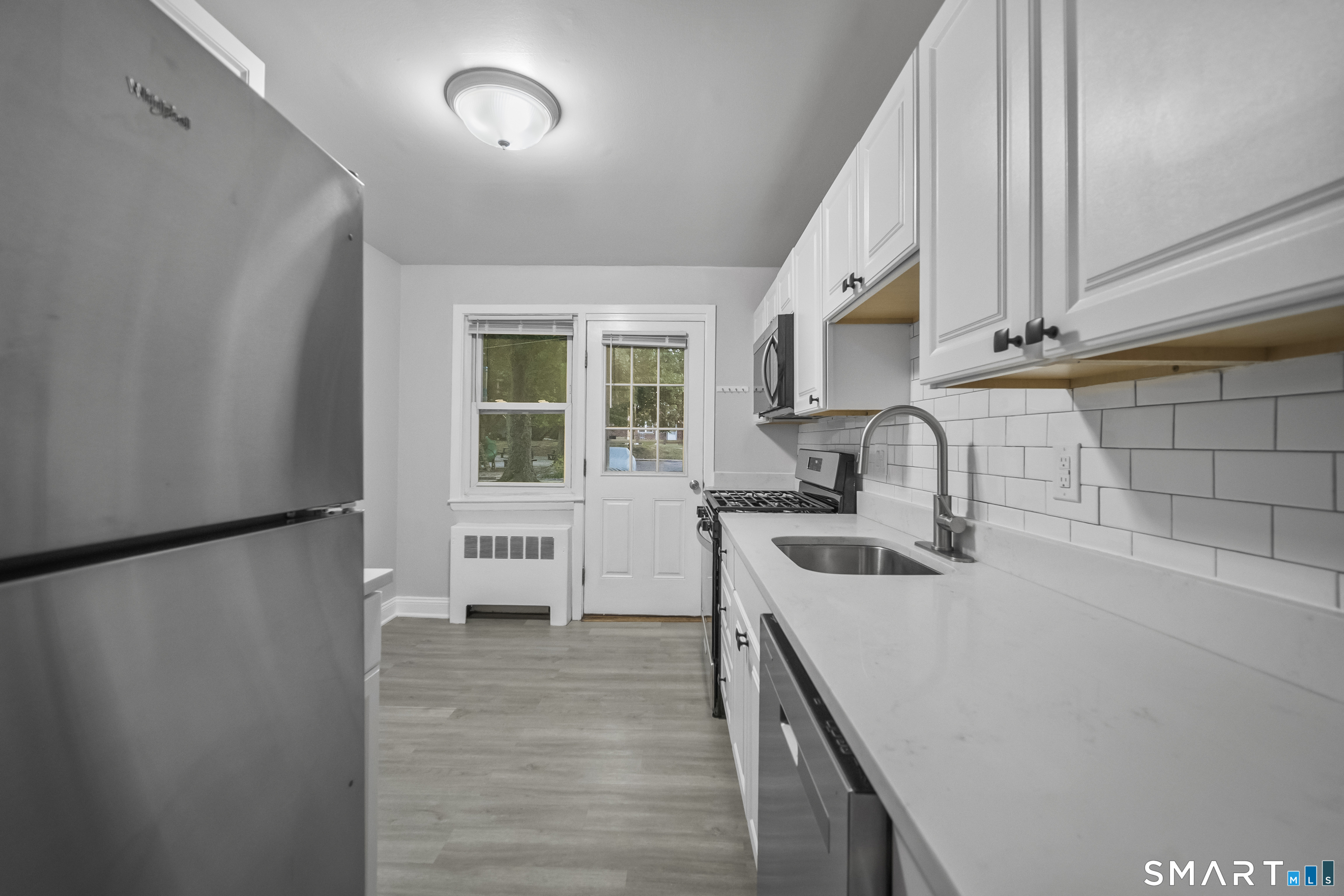 66 Blachley Road, Unit D Stamford, CT 06902 - Photo 4 of 34 Photos are of another unit that is a mirror image of this layout. Finishes may vary.