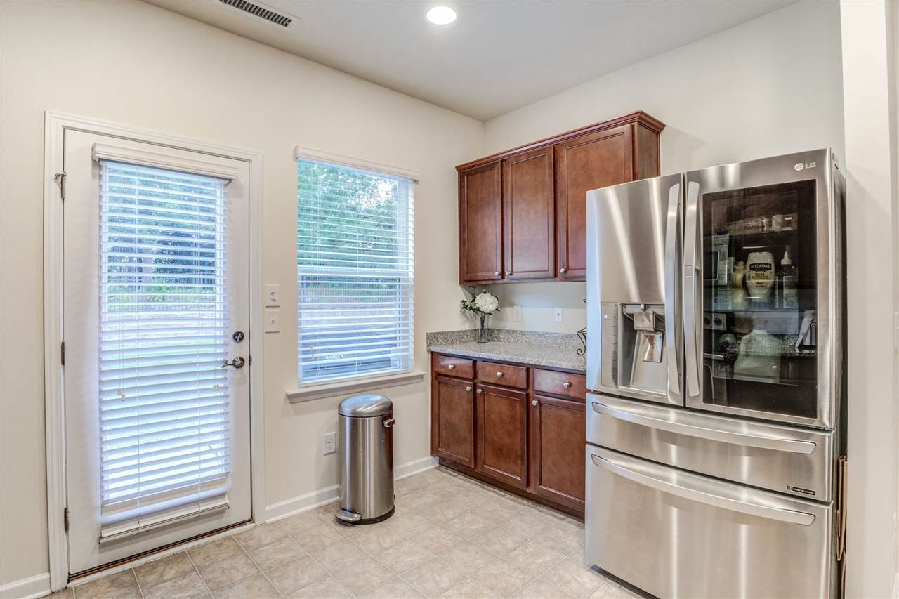3604 Althorp Drive Raleigh, NC 27616 - Photo 13 of 30 Easy access to the backyard patio for grilling - so much natural light really makes this kitchen a pleasure to be in. Kitchen