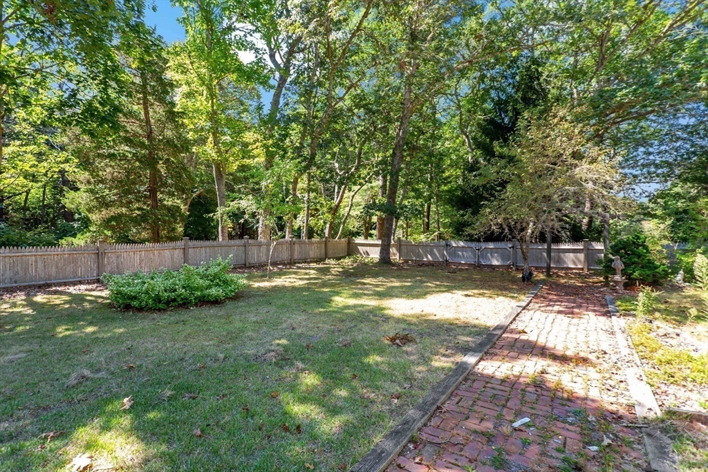 426 Old Post Road Barnstable, MA 02635 - Photo 21 of 27 a backyard of a house with lots of green space
