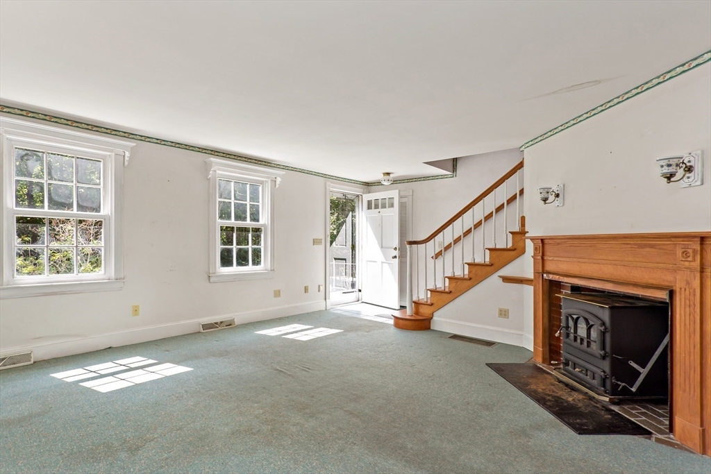 426 Old Post Road Barnstable, MA 02635 - Photo 5 of 27 a view of an empty room with stairs and windows