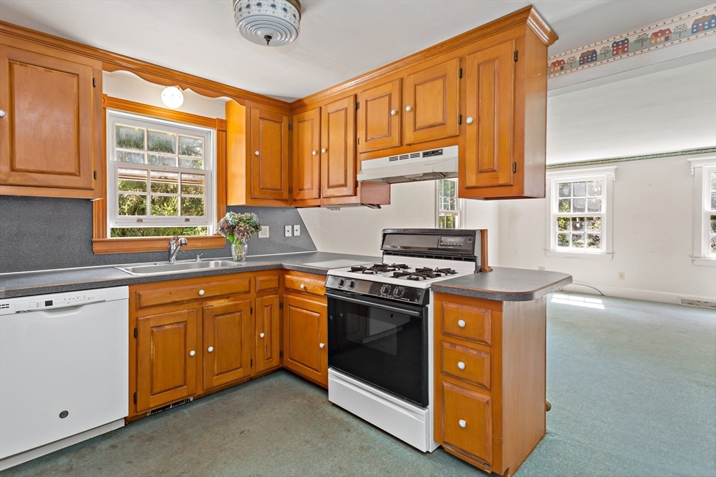 426 Old Post Road Barnstable, MA 02635 - Photo 6 of 27 a kitchen with stainless steel appliances granite countertop a stove and a sink