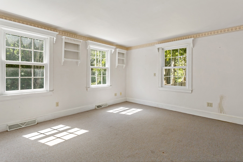426 Old Post Road Barnstable, MA 02635 - Photo 7 of 27 an empty room with windows