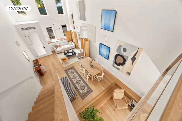 a view of living room with furniture and a fireplace