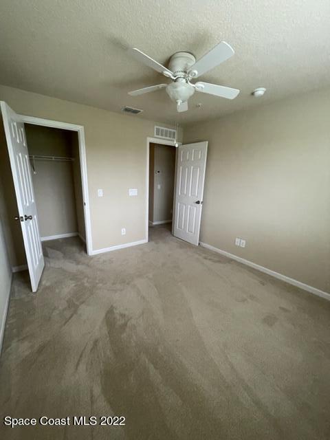 1420 Lara Circle, Unit 105 Rockledge, FL 32955 - Photo 14 of 20 an empty room with fan and entrance