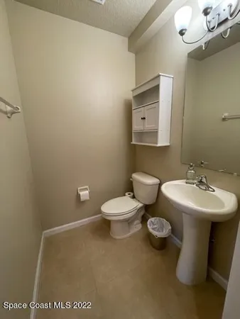 a view of an empty room with windows