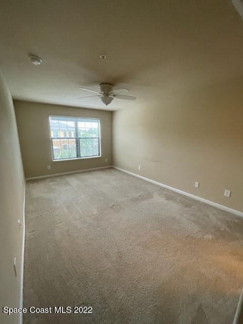 1420 Lara Circle, Unit 105 Rockledge, FL 32955 - Photo 7 of 20 a view of an empty room with windows