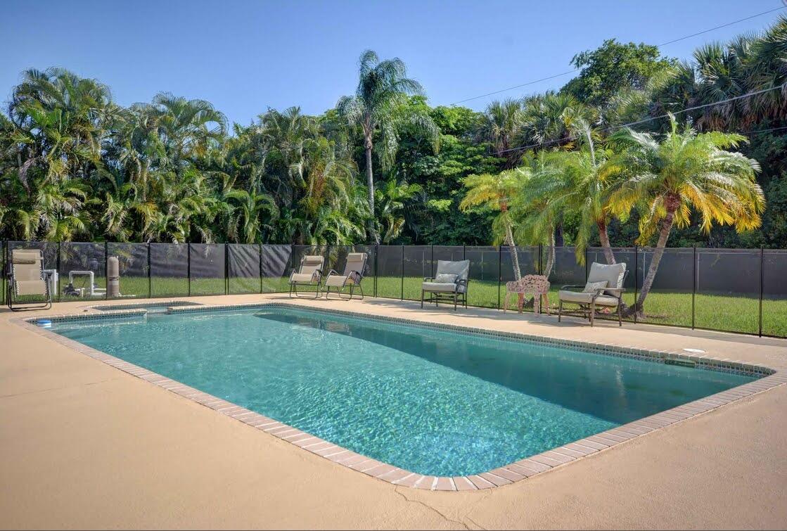 3855 Northwest 5th Avenue Boca Raton, FL 33431 - Photo 21 of 23 pool with palms