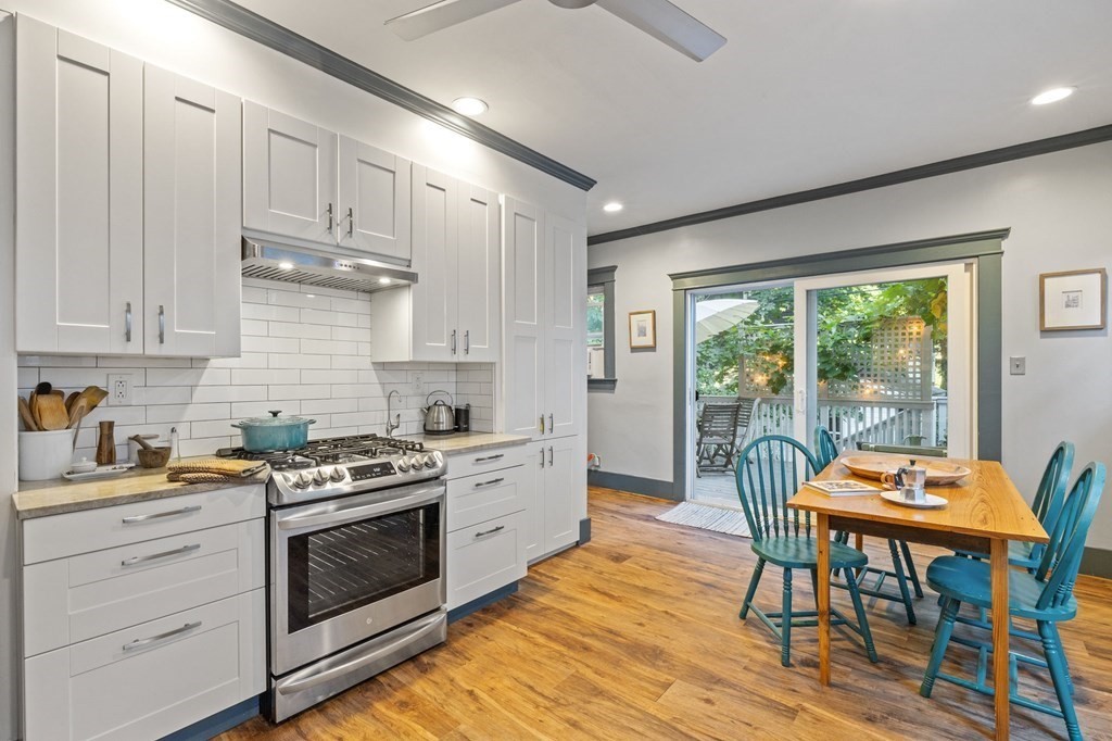 18 Alpha Road Boston, MA 02124 - Photo 13 of 42 a kitchen with stainless steel appliances a stove a sink a cabinets and wooden floor