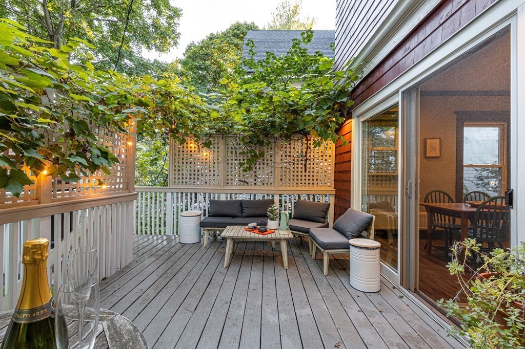 18 Alpha Road Boston, MA 02124 - Photo 16 of 42 a balcony with wooden floor table and chairs