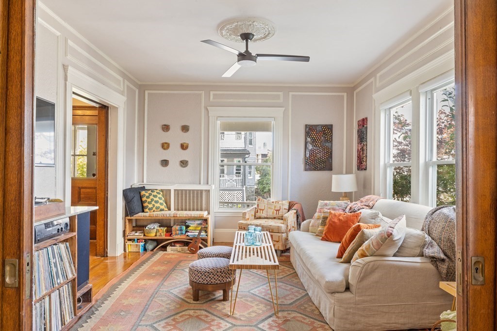 18 Alpha Road Boston, MA 02124 - Photo 2 of 42 a living room with furniture and a large window