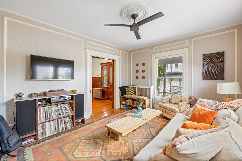 18 Alpha Road Boston, MA 02124 - Photo 3 of 42 a living room with furniture and a flat screen tv