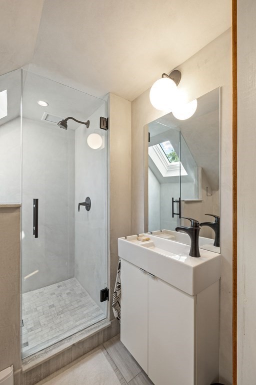 18 Alpha Road Boston, MA 02124 - Photo 32 of 42 a bathroom with a sink a toilet and shower
