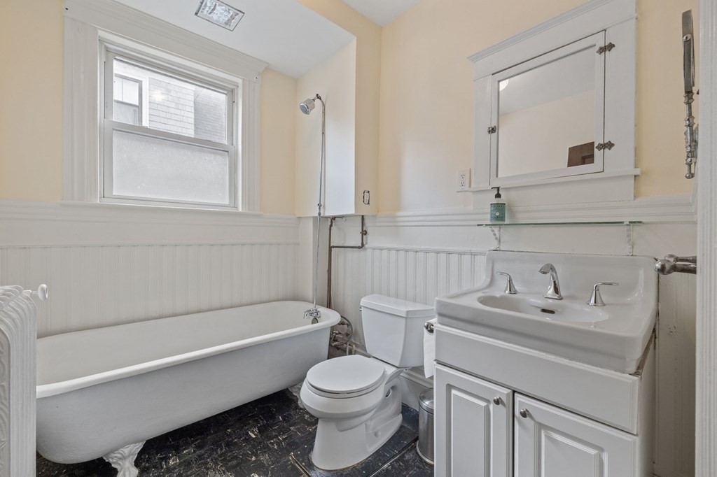 18 Alpha Road Boston, MA 02124 - Photo 37 of 42 a bathroom with a sink toilet and shower