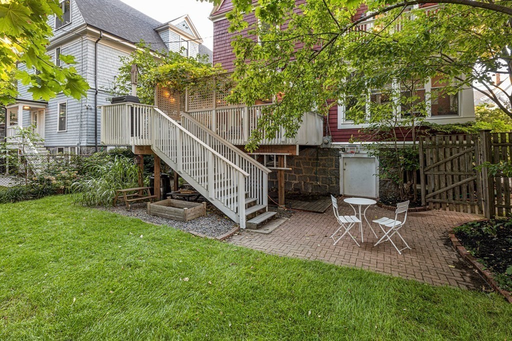18 Alpha Road Boston, MA 02124 - Photo 40 of 42 a view of backyard with house and outdoor seating