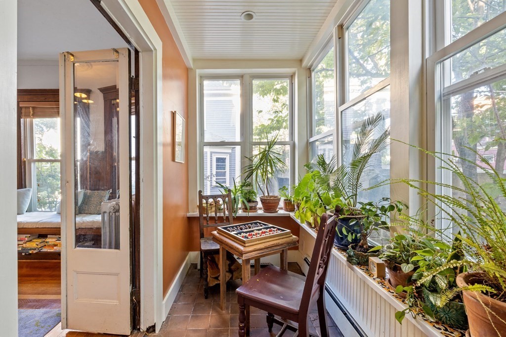 18 Alpha Road Boston, MA 02124 - Photo 9 of 42 a room with furniture and a potted plant