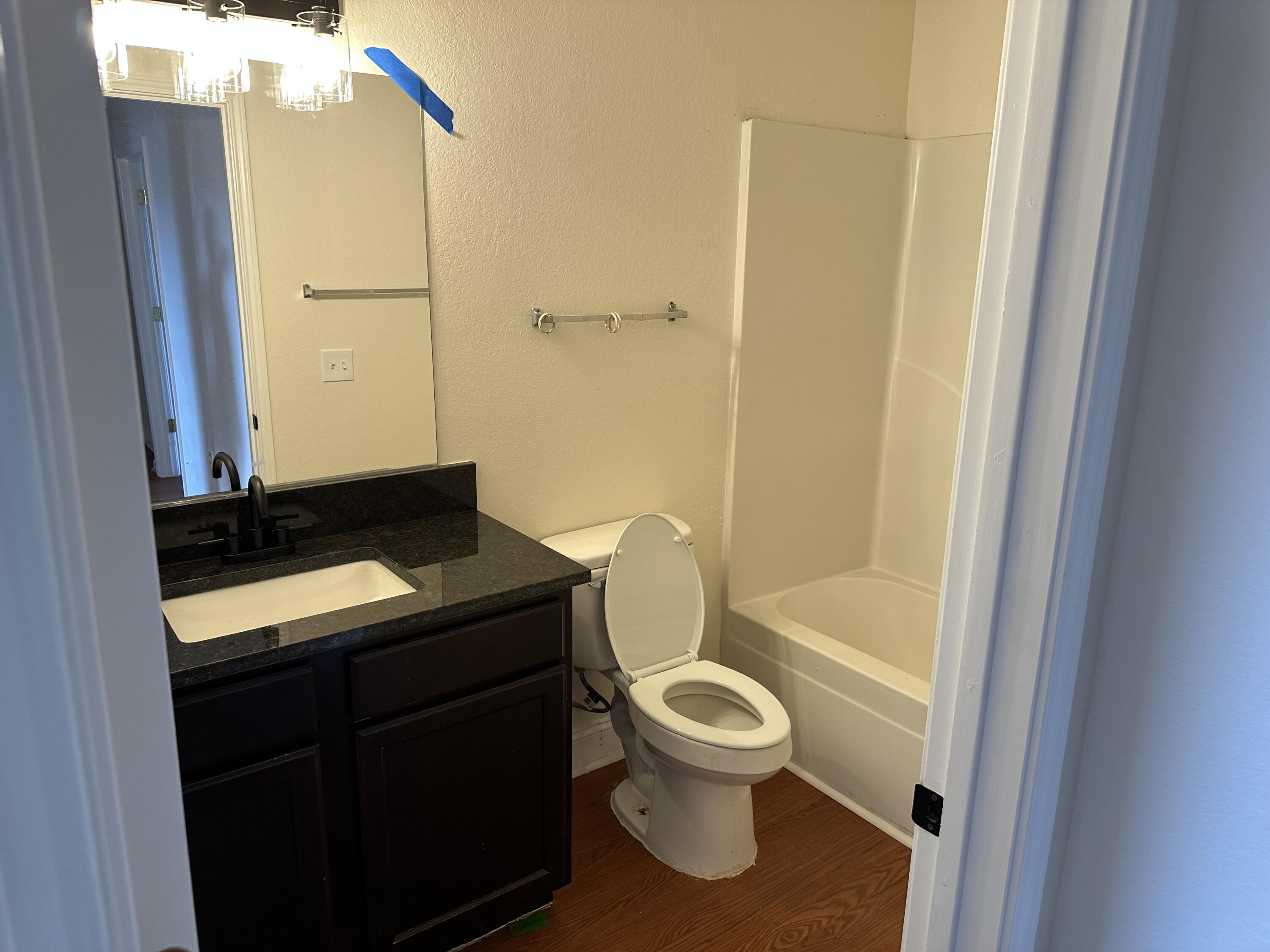 1150 Airport Road, Unit 138 Destin, FL 32541 - Photo 10 of 16 a bathroom with a sink a toilet and shower