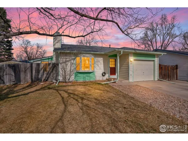 a view of a house with a yard and garage