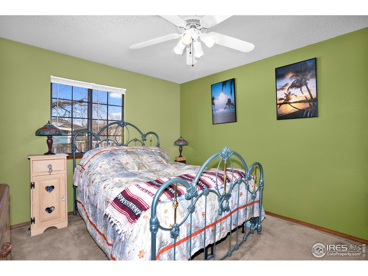 151 3rd Street Frederick, CO 80530 - Photo 15 of 45 a bedroom with two beds and a chandelier