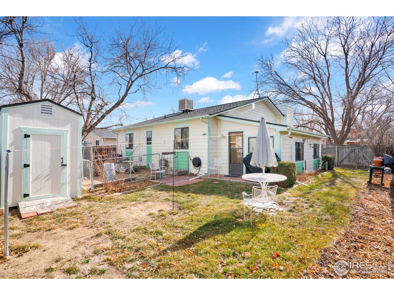 151 3rd Street Frederick, CO 80530 - Photo 20 of 45 a view of a house with a yard patio and fire pit