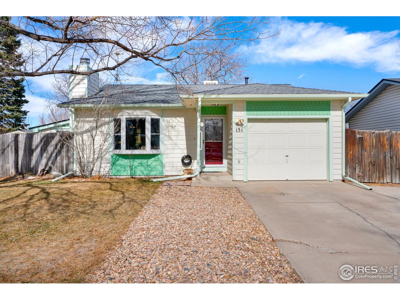 151 3rd Street Frederick, CO 80530 - Photo 2 of 45 a front view of a house with a yard and garage