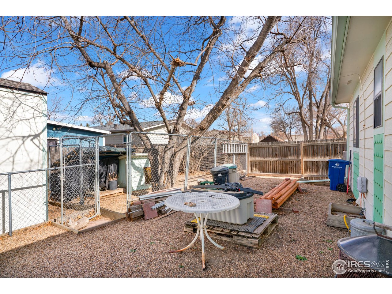151 3rd Street Frederick, CO 80530 - Photo 21 of 45 a backyard of a house with outdoor seating