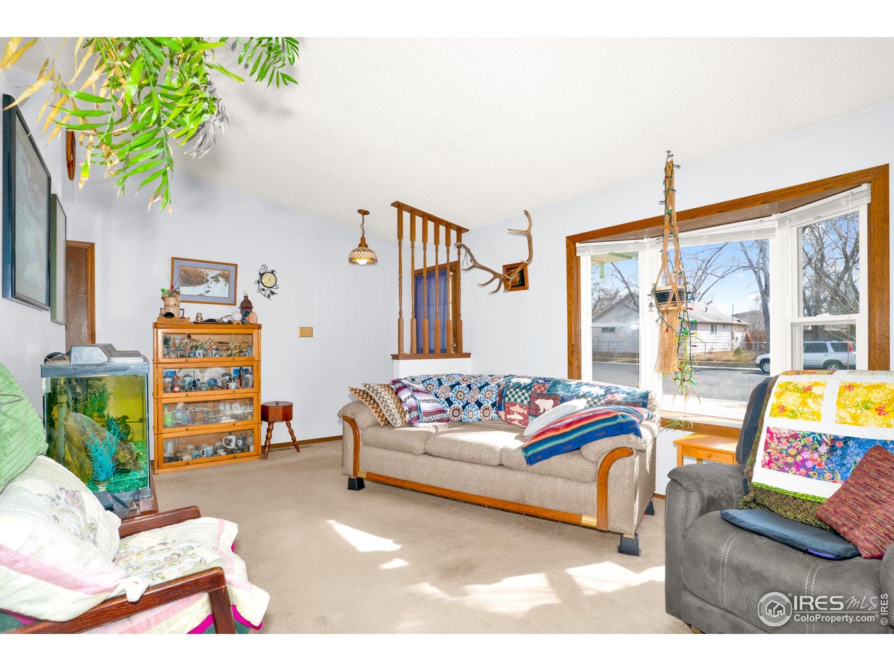 151 3rd Street Frederick, CO 80530 - Photo 5 of 45 a bedroom with a bed and a couch