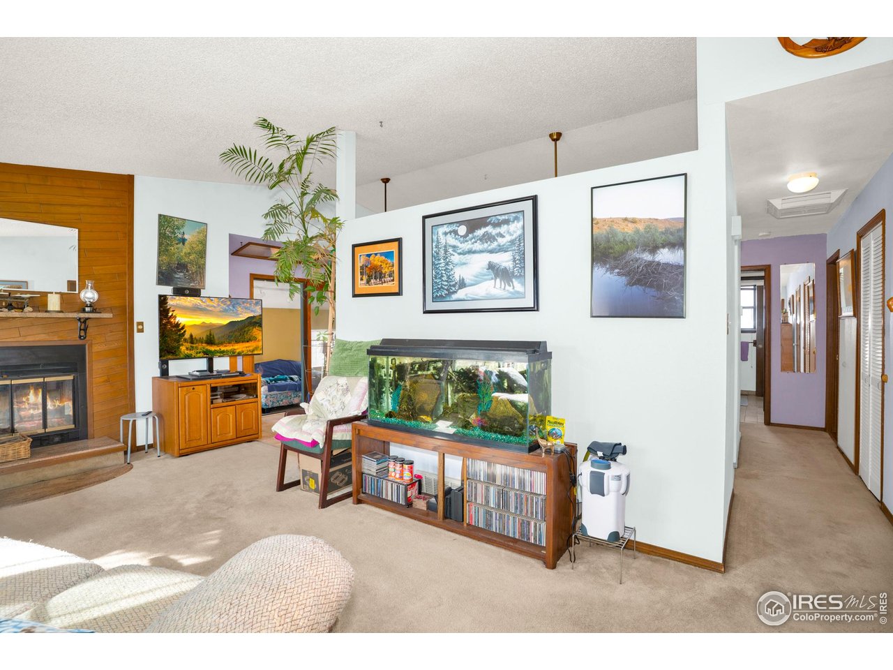 151 3rd Street Frederick, CO 80530 - Photo 8 of 45 a bedroom with furniture and a chandelier