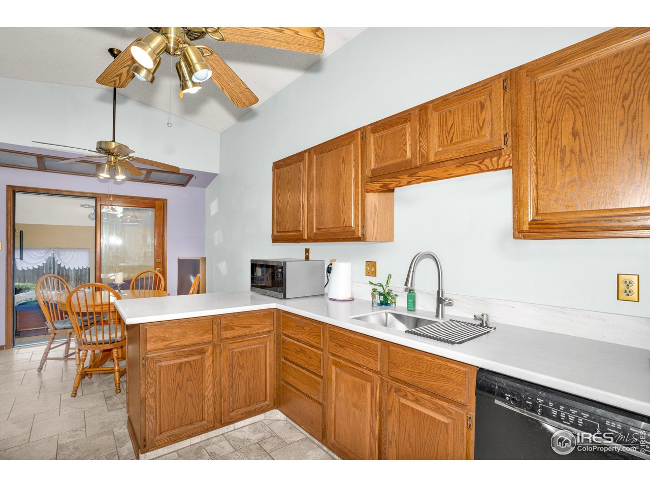 151 3rd Street Frederick, CO 80530 - Photo 9 of 45 a kitchen with a sink cabinets and window
