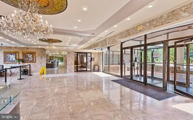 a view of a lobby with furniture and floor to ceiling window