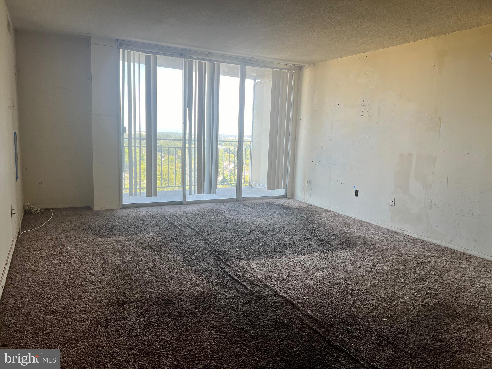 1836 Metzerott Road, Unit 1717 Hyattsville, MD 20783 - Photo 4 of 12 a view of an empty room with a window