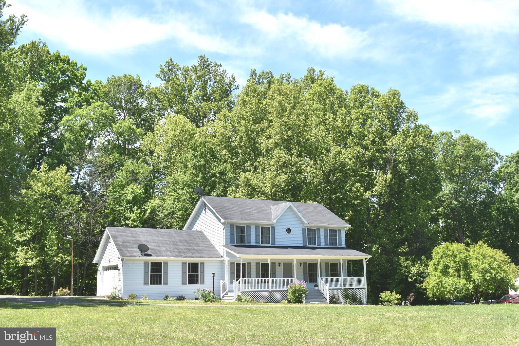 10958 Mountain Run Lake Road Culpeper, VA 22701 - Photo 31 of 31 a front view of a house with a garden