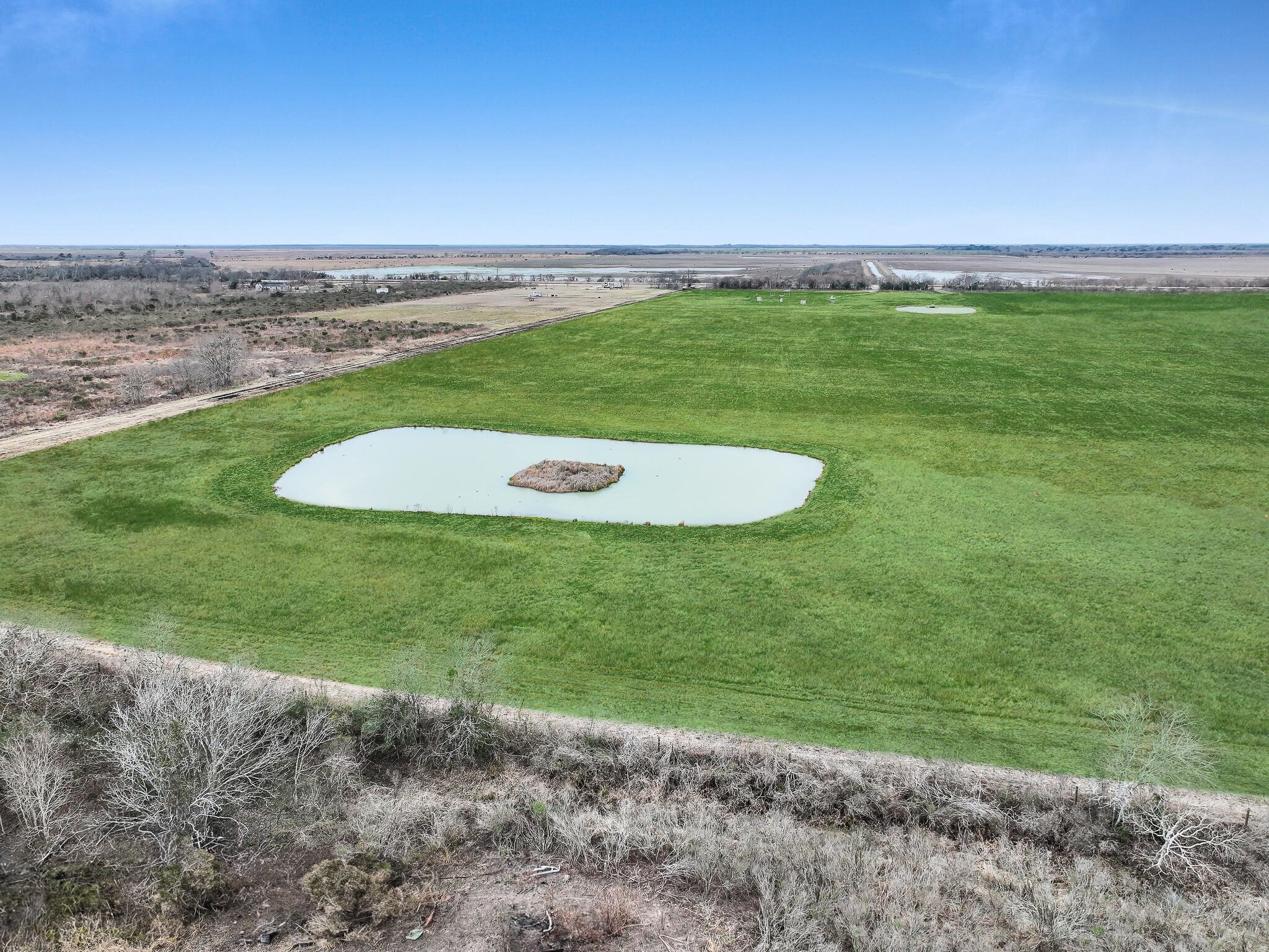 747 Canal Road Winnie, TX 77665 - Photo 11 of 21 a view of a field with an ocean